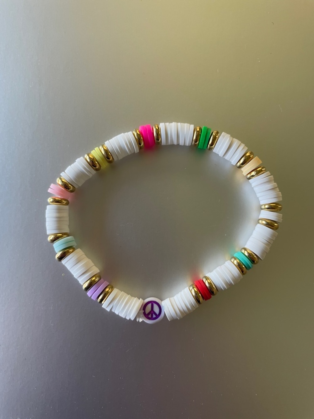 White Bead Stretch Bracelet with Multicolor Accents and Gold Spacers